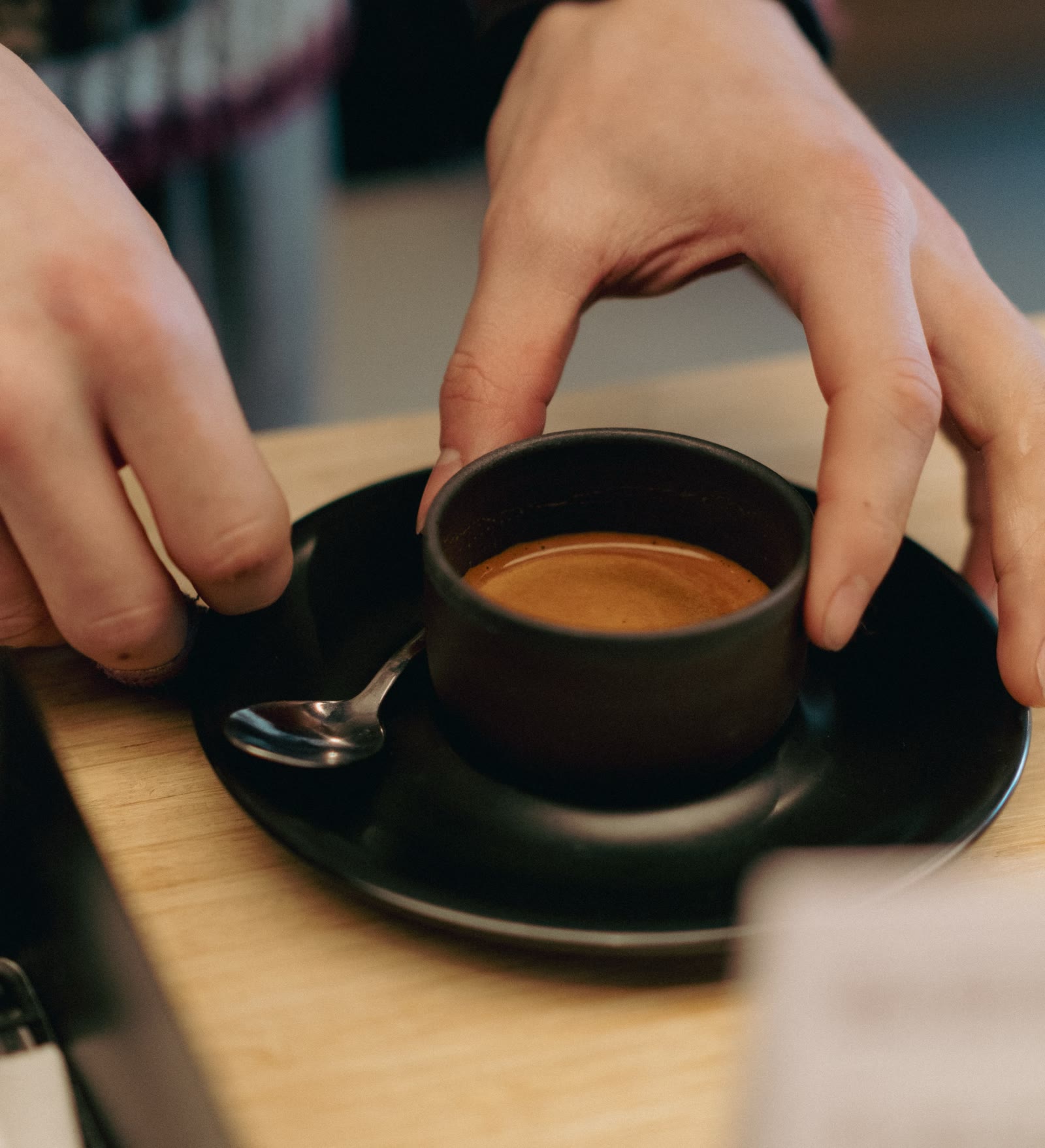 a cup passed across the counter