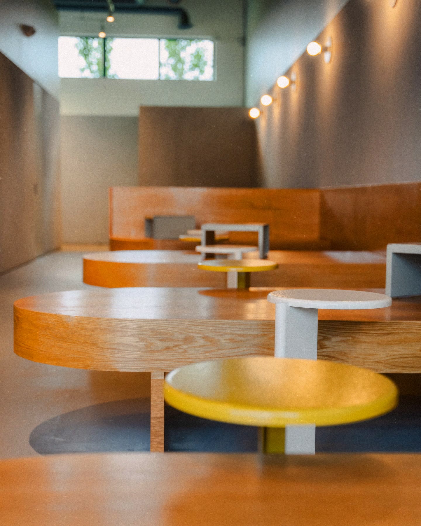 sunlight across the little round tables